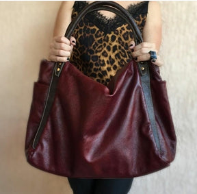 Bolsa AMSTERDÃ em couro legítimo